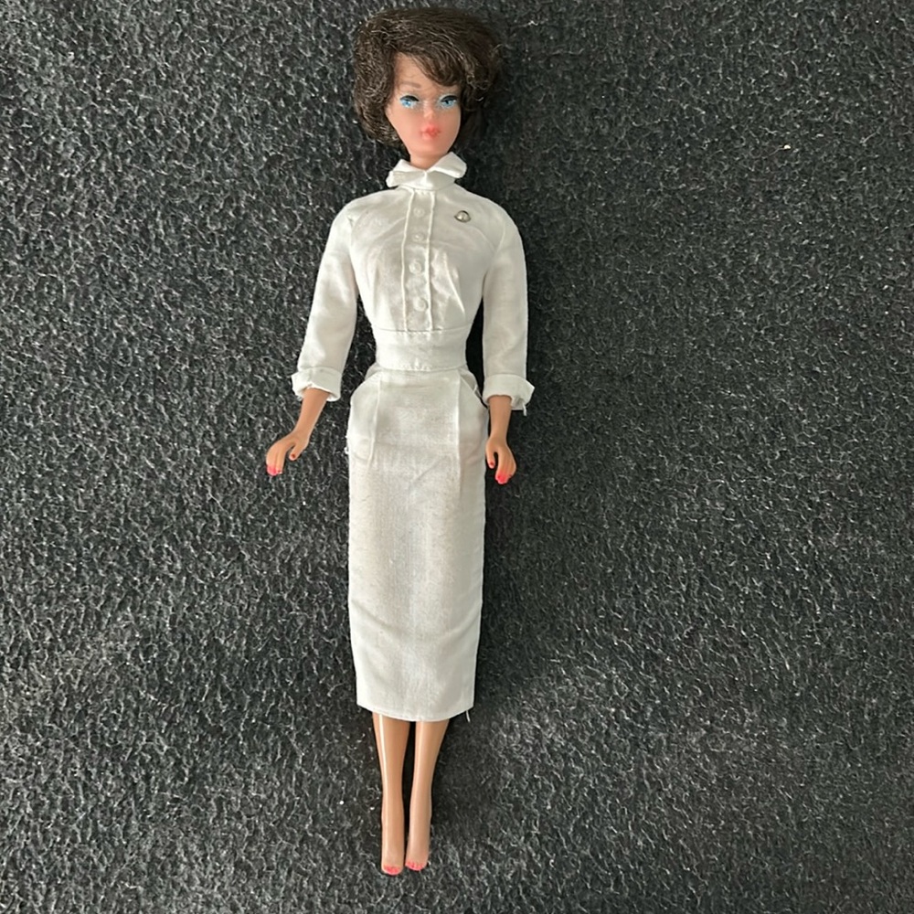 Barbie: 1960’s bubble cut hairstyle, nurse uniform.